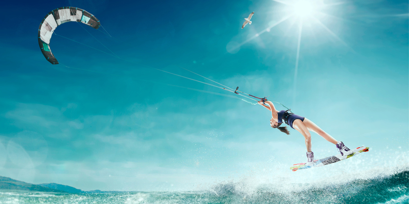 A kitesurfer performing a trick